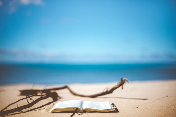 An open book on the beach.