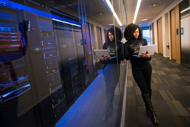A woman provides oversight within a data center