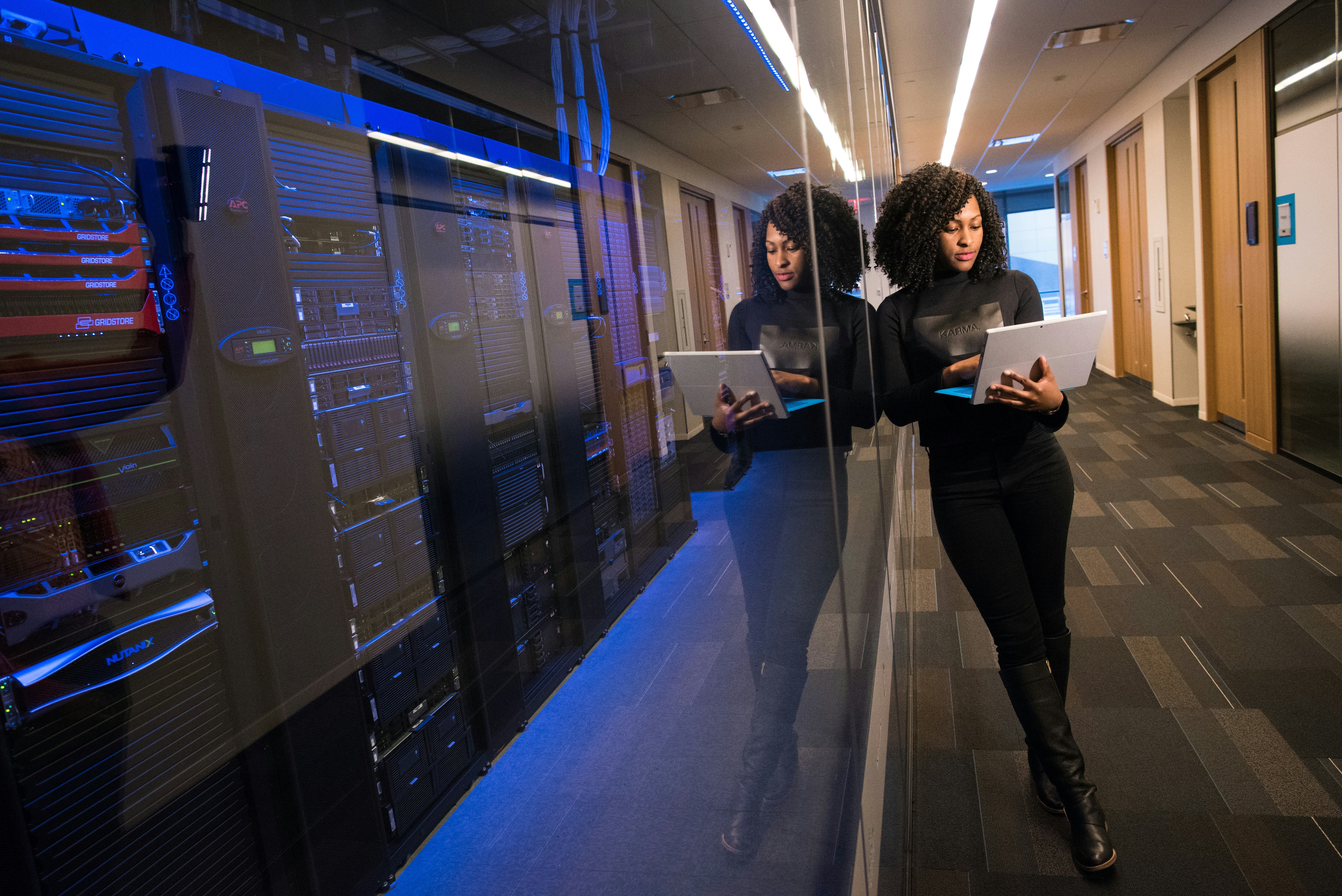 A woman provides oversight within a data center