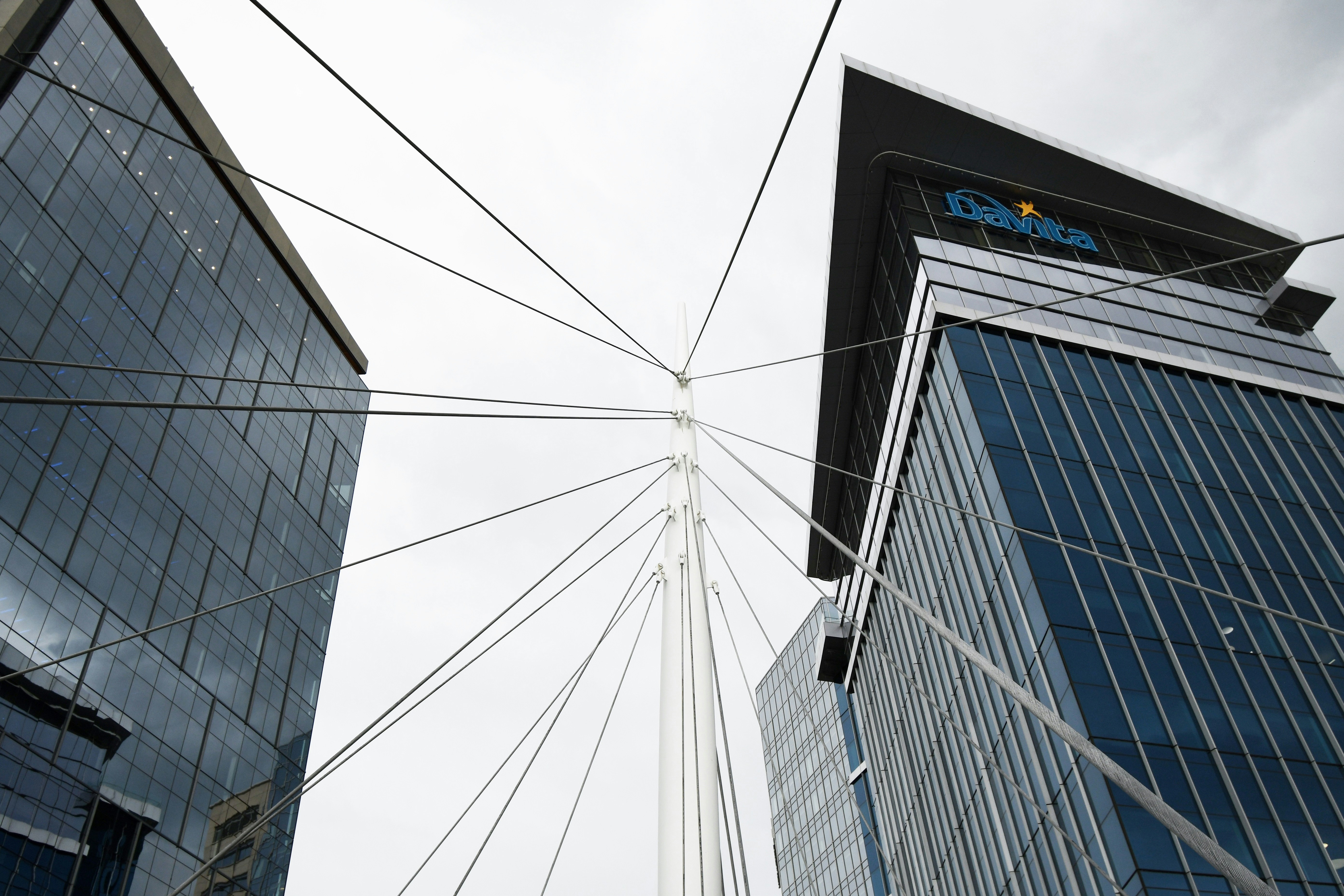 A series of wires converging or radiating from a center, implying both mergers and divestiture. 