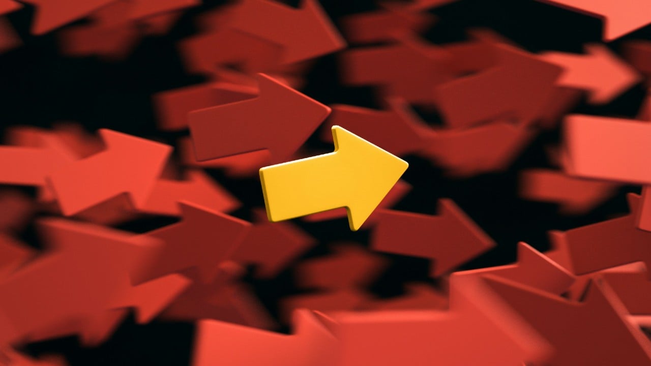 A lone yellow arrow graphic amid a pile of red and orange arrows, implying a single source of truth.